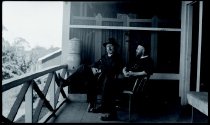 Father Otto (Wulfram) Duchting, SS.CC., and Brother Wenceslas Van Vorst, SS.CC., on the porch of the rectory of Immaculate Conception Church, Honokaa, Hawaii Island.